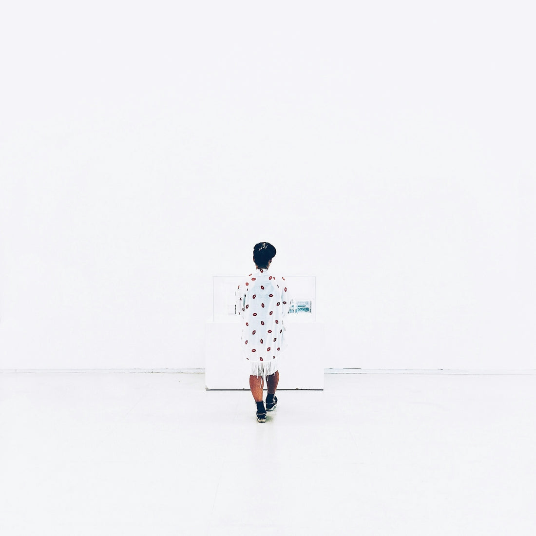 woman in white and red polka dot mini dress
