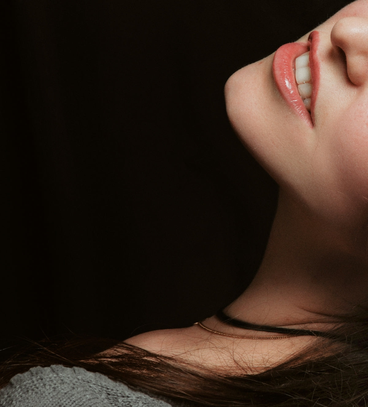 a woman's face with her mouth open