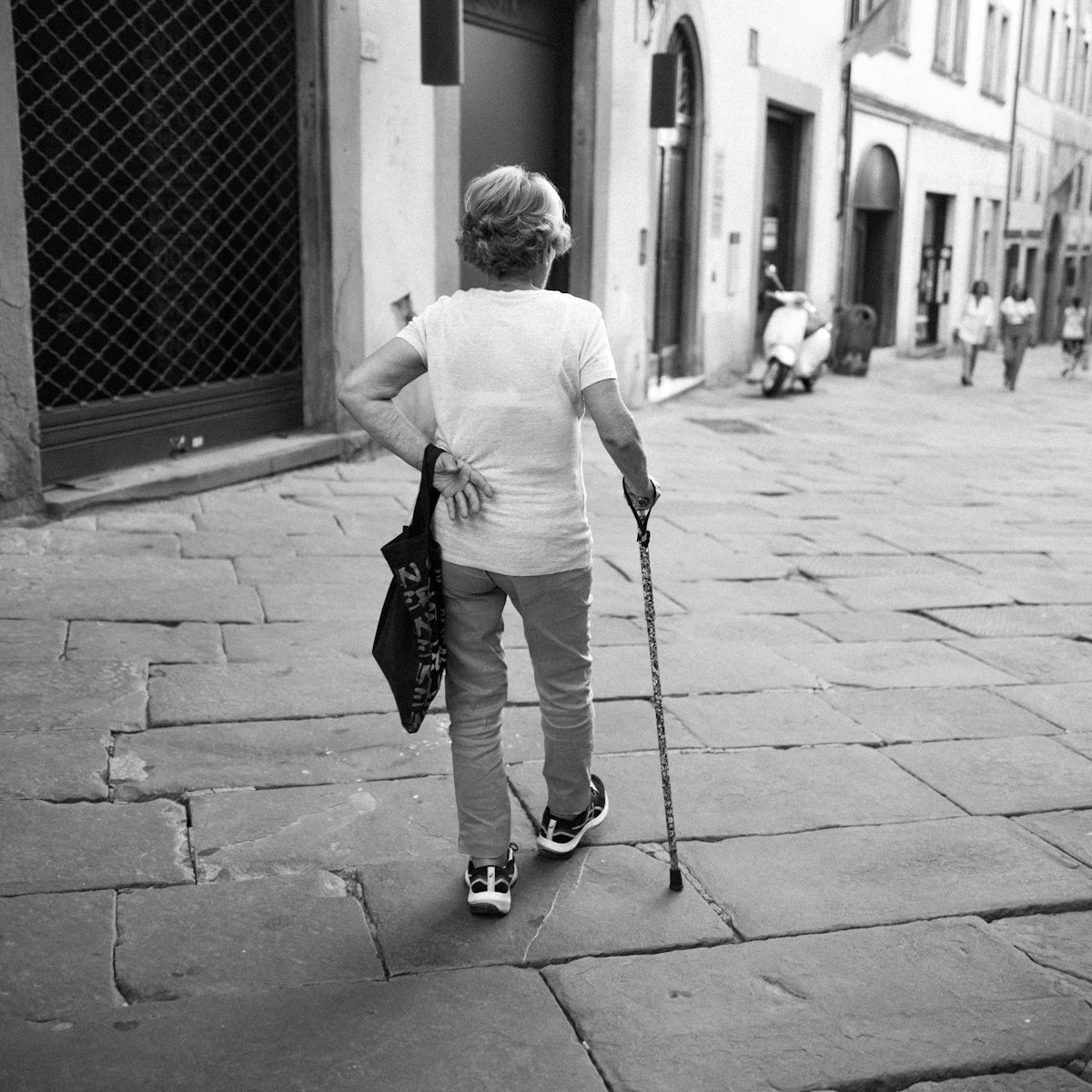 a man walking down a sidewalk