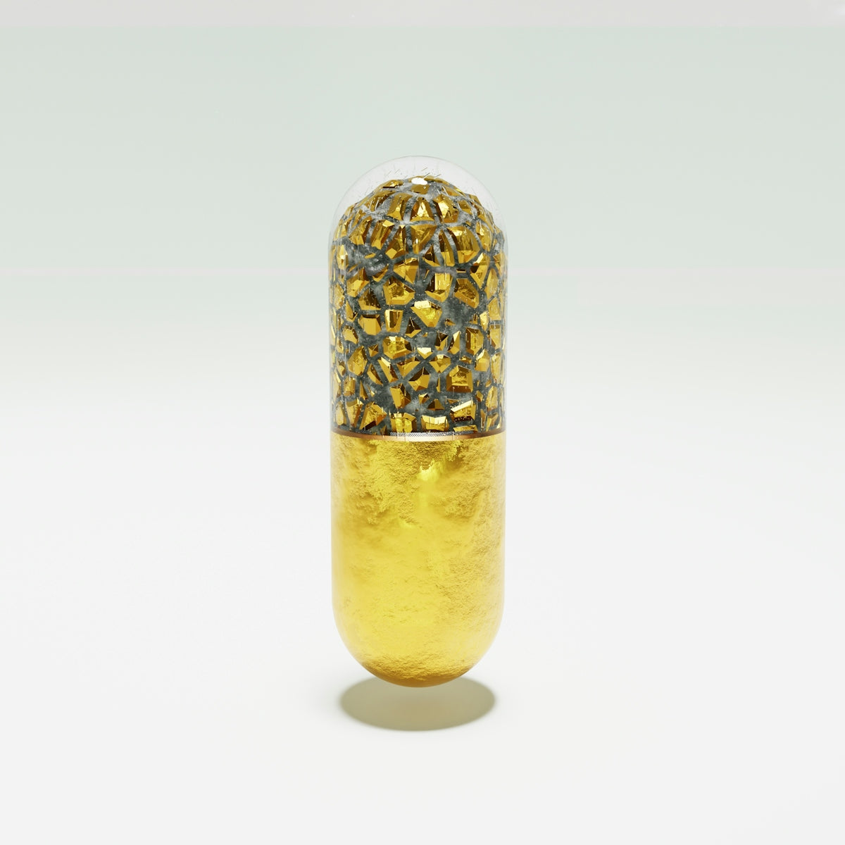 a gold pill pill with a white background