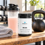 BCAA Post Workout Powder 2:1:1, Honeydew Watermelon on a wooden bench in a bright home gym after a workout