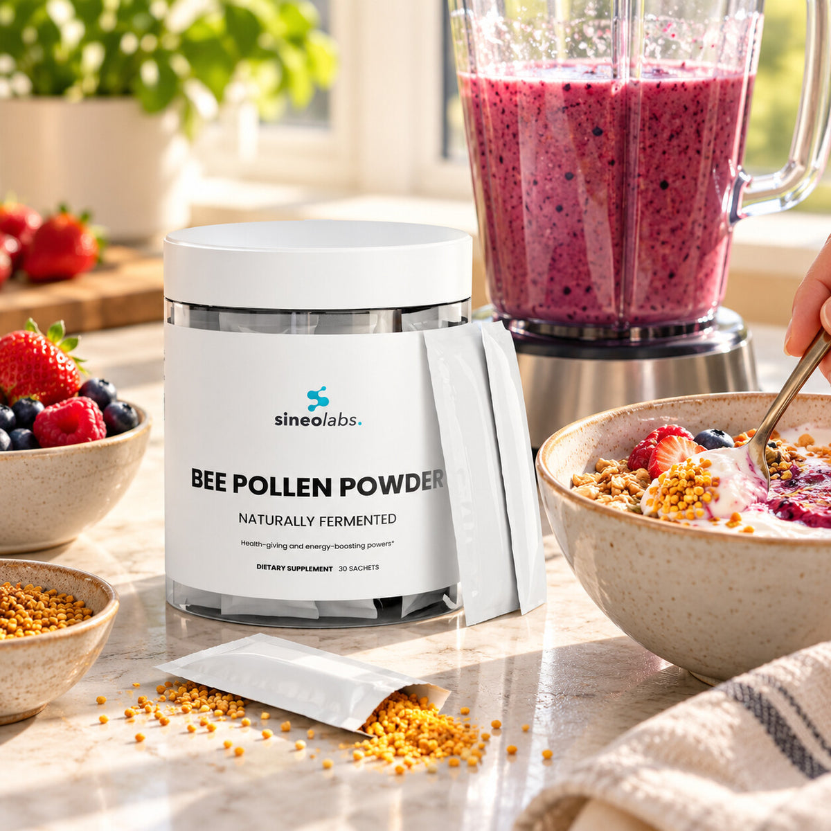 Bee Bread Powder 2,500mg with Royal Jelly & Propolis on a sunny kitchen counter beside a blender of berry smoothie