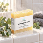Breathe Clear Eucalyptus & Peppermint Soap Bar on a white-tiled shower ledge in soft early-morning light