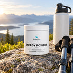 Energy Powder, 200mg Caffeine, Yuzu on a flat granite rock at a mountain overlook in soft morning light