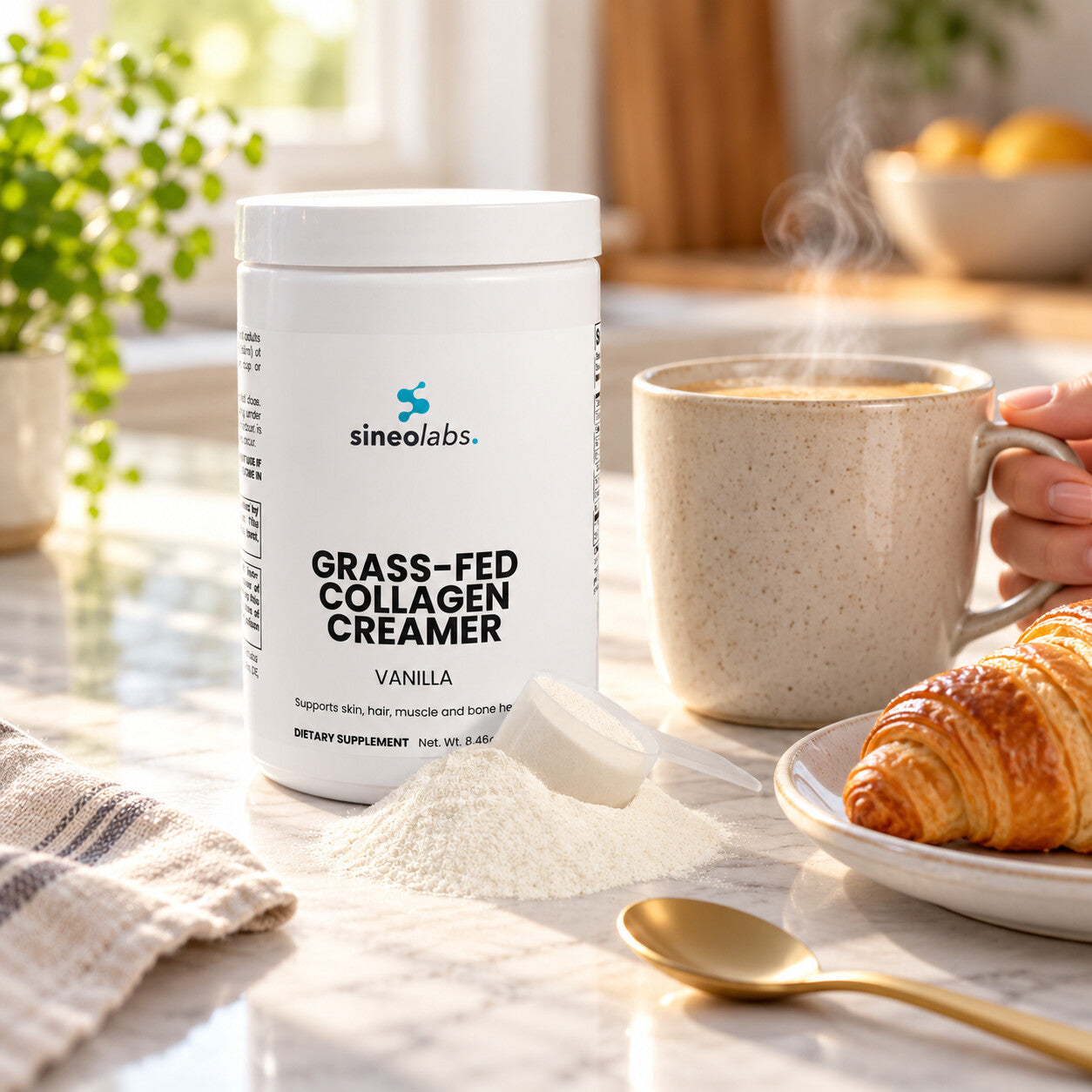 Grass-Fed Collagen Creamer with MCT, Vanilla on a sunny kitchen counter beside a steaming mug of creamy coffee