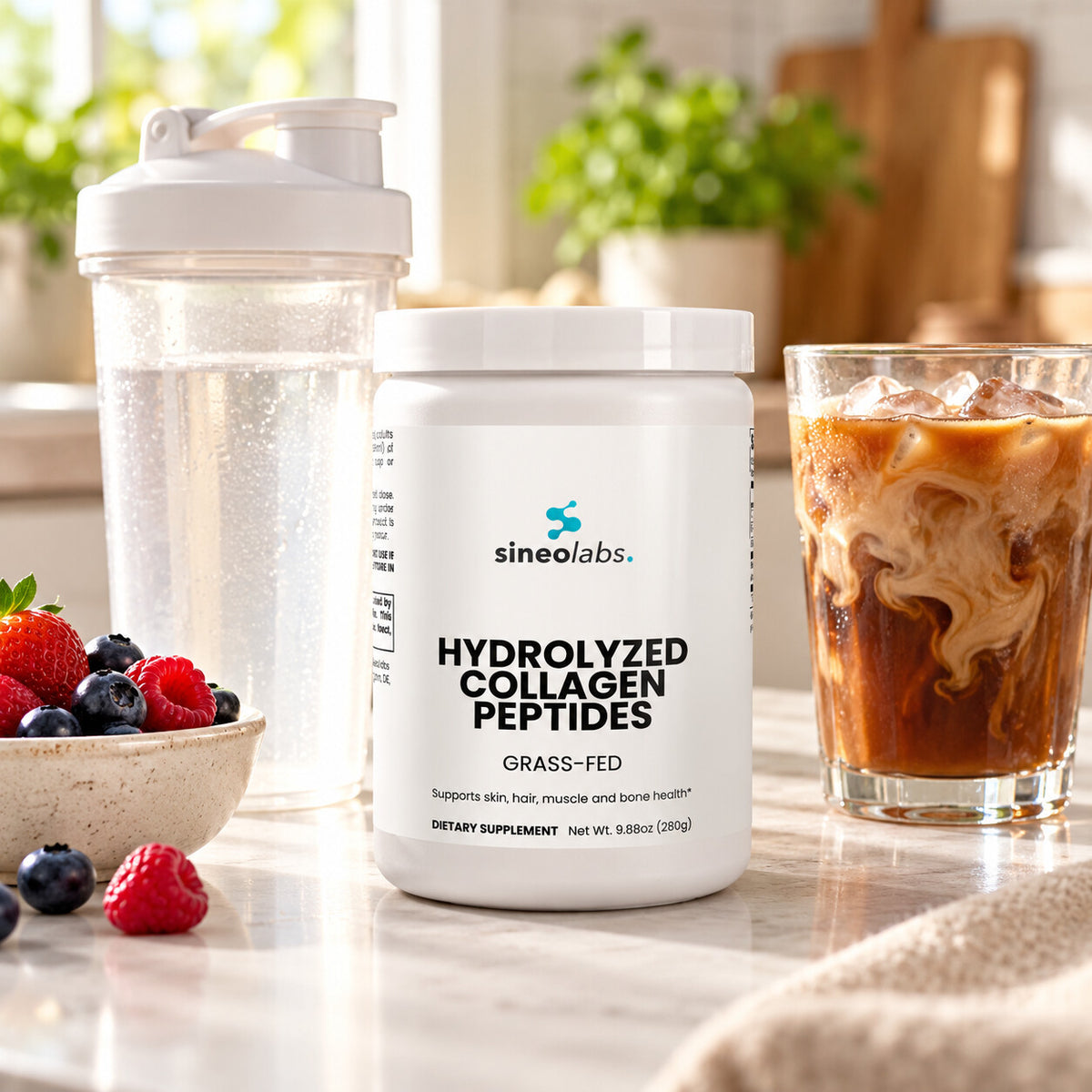 Grass-Fed Hydrolyzed Collagen Peptides Powder 20g on a light kitchen counter in soft morning light beside a shaker cup of water and a glass of iced coffee