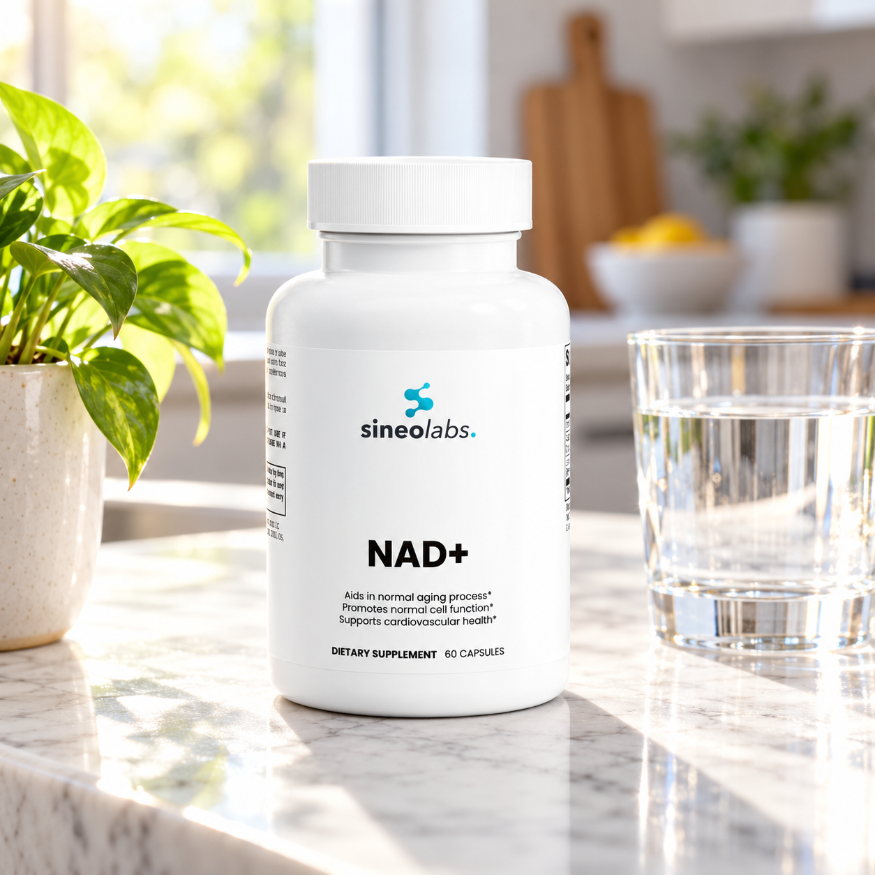 NAD+ on a marble kitchen counter beside a glass of water