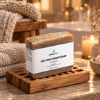 Oat Milk Honey Soap Bar with Goat Milk & Oatmeal on a wooden soap dish in a warm