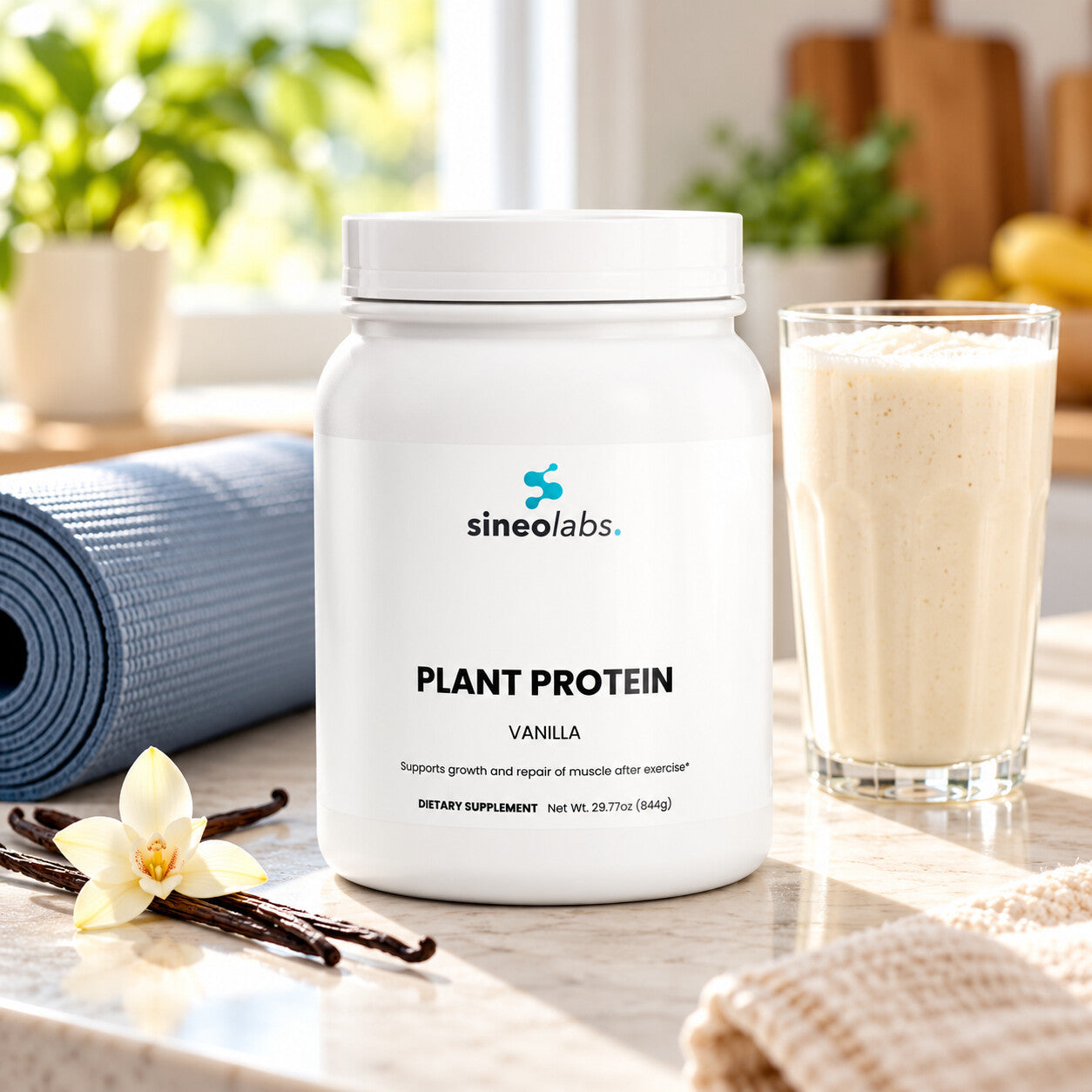 Plant Protein Powder, 20g Protein, Vanilla on a kitchen counter in bright morning light beside a tall glass of creamy shake and a rolled yoga mat