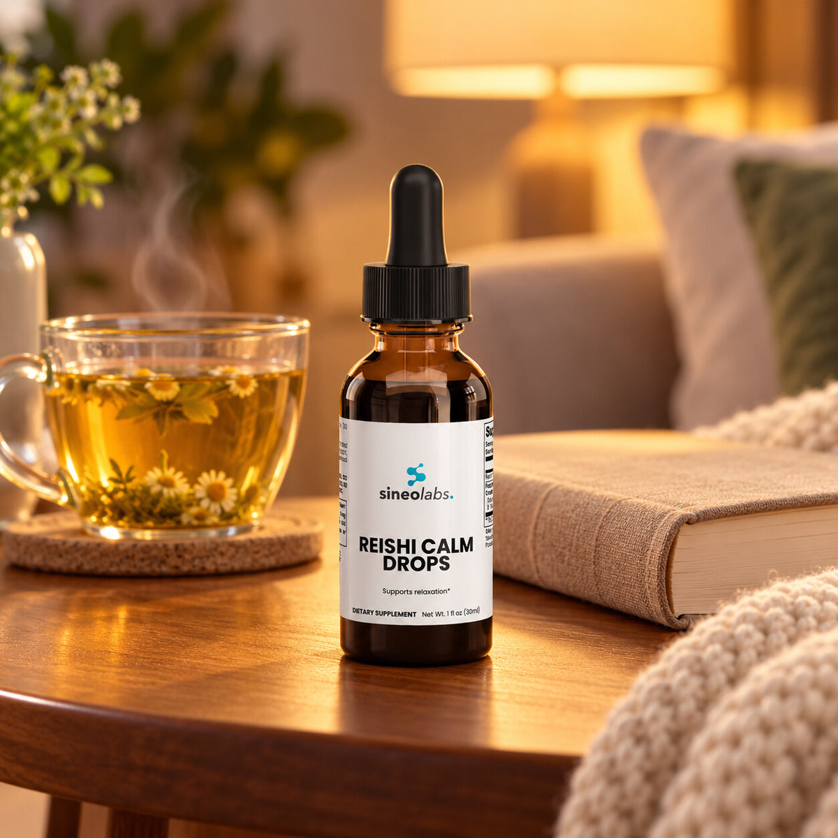 Reishi Calm Drops, 150mg Reishi Extract on a side table in warm evening lamplight